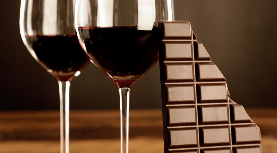 glasses of wine and a bar of chocolate
