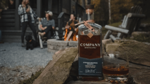 Bottle of Company Bourbon at a campfire gathering